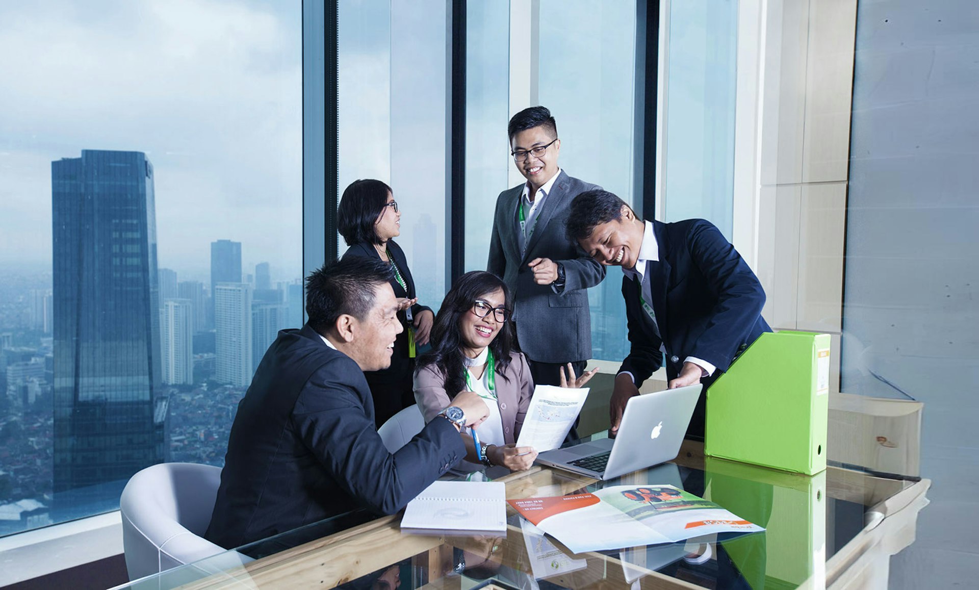 A group of business people sitting around a table